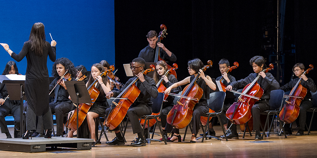Summer Arts Institute Strings Ensemble playing on the stage at Frank Sinatra High School of the Arts