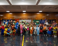 The Chancellor and PS 345 staff and students in costumes celebrate Halloween.