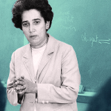 Black and white photograph of Antonia Pantoja in a classroom. The background is tinted green.