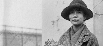 Dr. Mabel Lee holding a bouquet of flowers