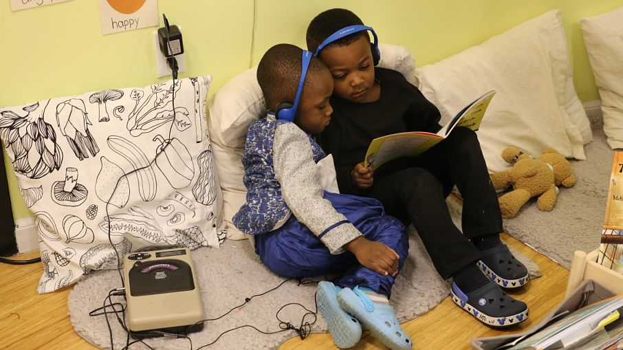 Students listen to an audiobook together. 