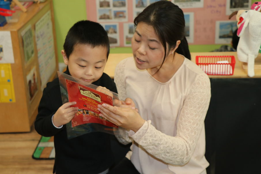 Mother reading with student
