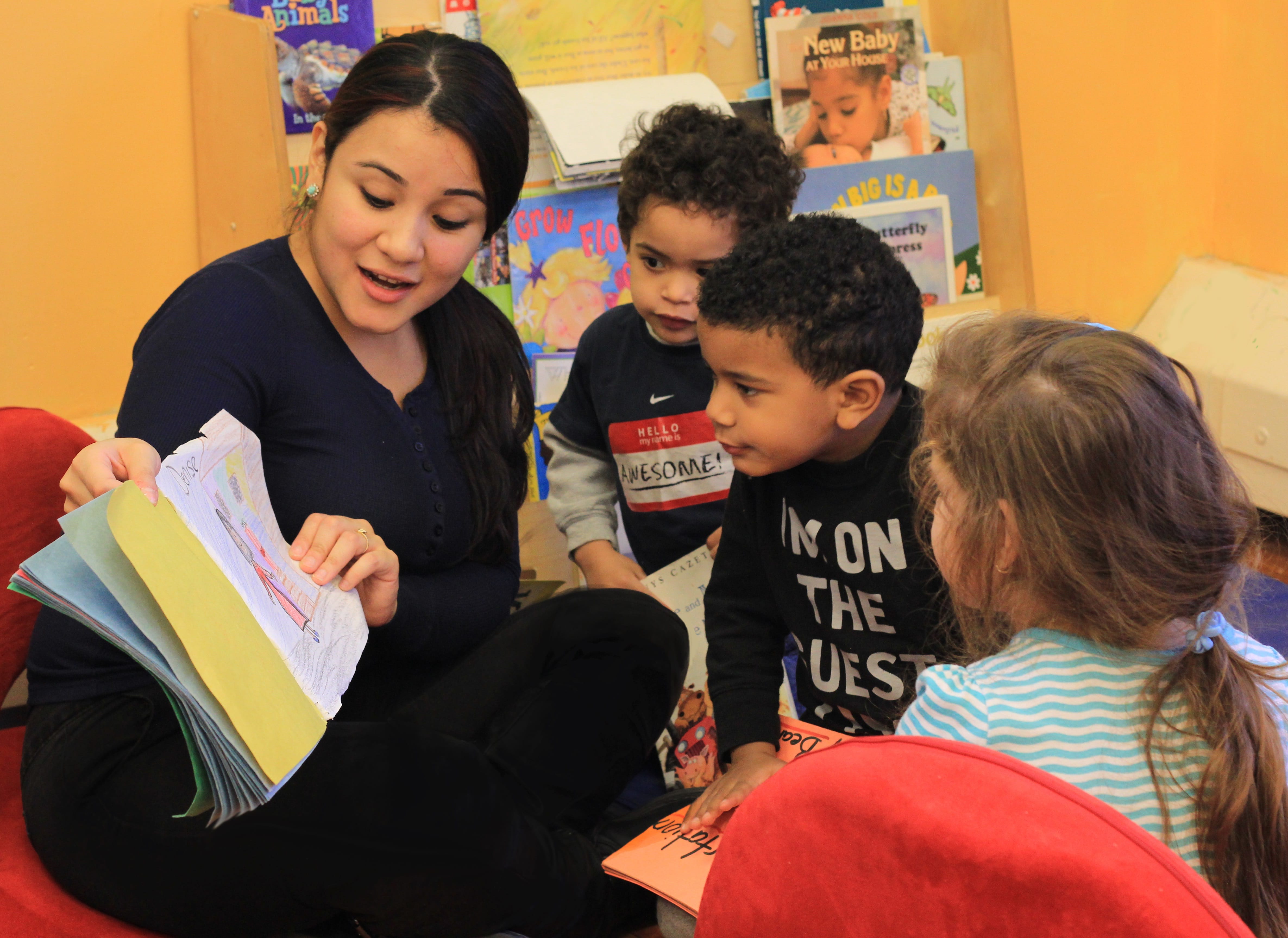 A teacher reads aloud with young children. 