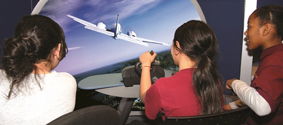 Students with a flight simulator