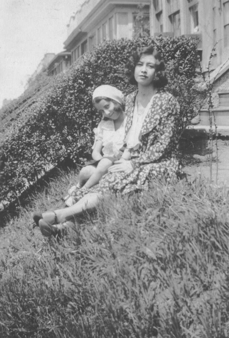 Black and white photograph of Eugenie Clark (left) and her mother (right) sitting on steps.