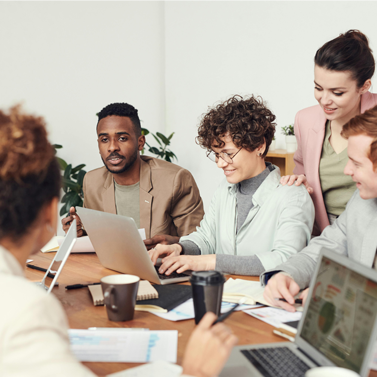 Group of adults at a table in a meeting with each other