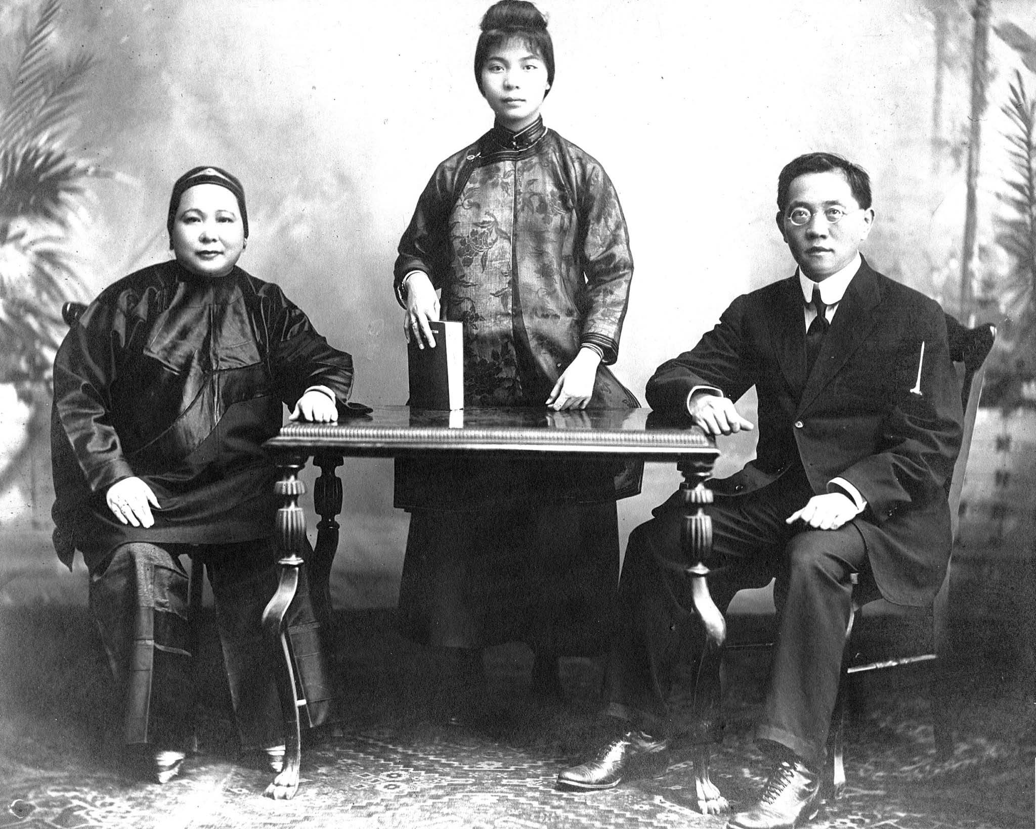 Photo of Mabel Lee's family; Mabel's mother on the left, father on the right, and Dr. Lee in the middle