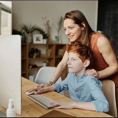 Mom and child looking at a monitor