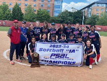 The High School of American Studies' softball team posing behind a banner that reads, "2023–24 Softball "1A" PSAL Champions"